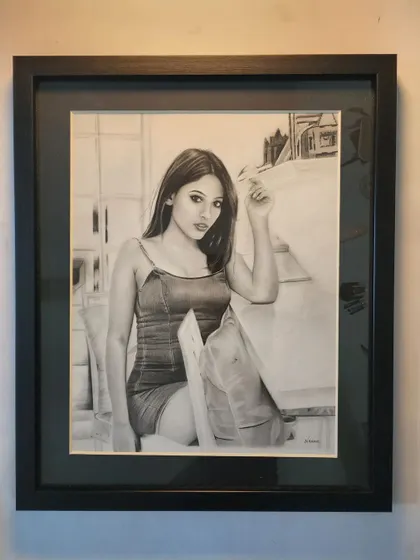 The finished full-length portrait in a black frame.