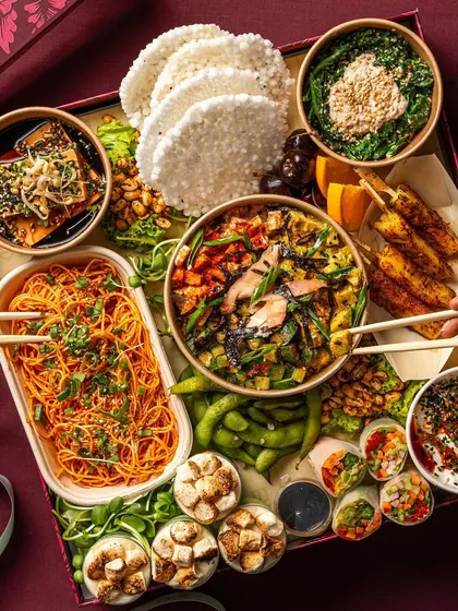 My Asian Tapas Box is a journey of flavors, featuring items like cold noodles, edamame, and savory satay. It’s a complete meal experience designed to be shared and enjoyed together.