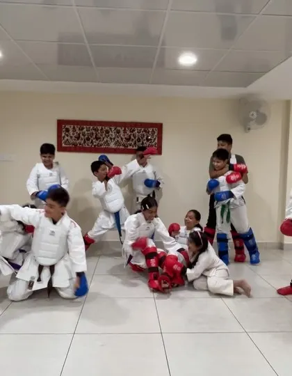After a structured practice, there's always room for some fun. Here, our students enjoy a moment of play after a challenging kumite session.