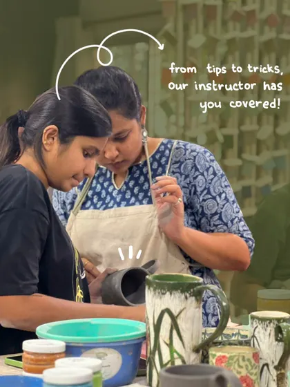 Our instructor is here to help! A shot from our Sgraffito workshop, showing a student getting tips and tricks to perfect their carving technique.
