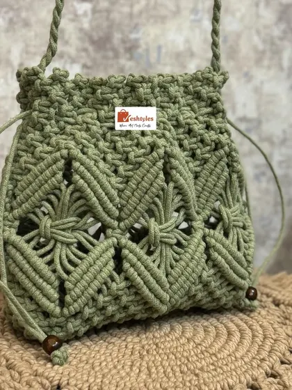 The intricate diamond pattern on this potli bag is one of my favorite designs to create.