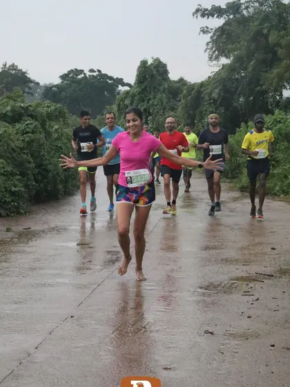 Embracing the joy of running in the rain. Sometimes you just have to jump in the puddles and have fun.