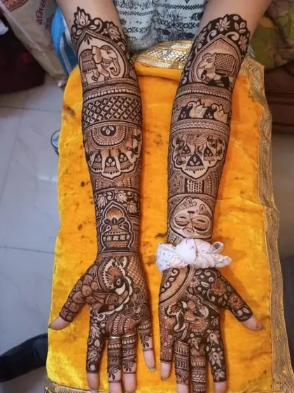 This design is packed with traditional symbols, including elephants, peacocks, and bride-groom figures, perfect for a classic Indian wedding.