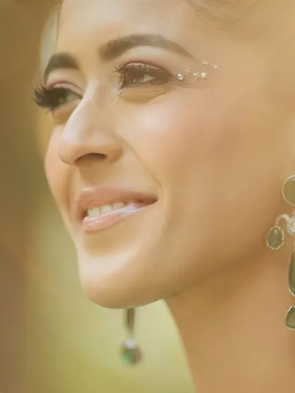 A close-up showing the subtle shimmer on the eyes and the glowing skin, perfect for a magical-themed event.