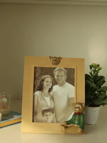 A single teddy bear photo frame, perfect for adding a touch of nostalgia and warmth to any shelf or desk. It’s a sweet way to keep your loved ones close.