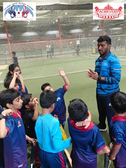 Our Head Coach Prashant Bhoir leading a coaching session with young cricketers at the CYCA indoor facility in Chicago. Our global coaching program ensures players receive consistent, high-quality instruction.