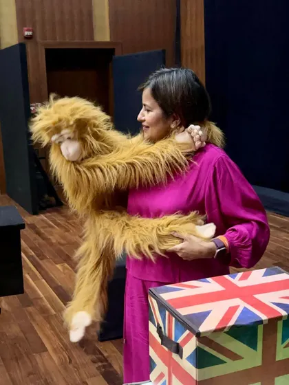 Sharing a hug with Darwin the monkey puppet before a full house show for kids at the Nita Mukesh Ambani Cultural Center.