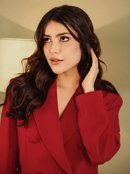 Regal in red. This look is all about power and elegance, and the makeup reflects that with its clean lines and sophisticated finish.