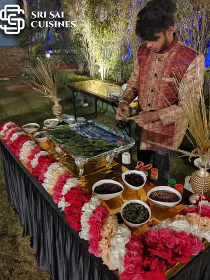 A beautifully arranged paan counter ready for service. The setup includes fresh flower decorations and a variety of mukhwas, showcasing my attention to detail and presentation.