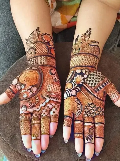 This design is full of vibrant, bold patterns. It combines floral motifs with geometric shapes and peacock elements for a festive and eye-catching look.