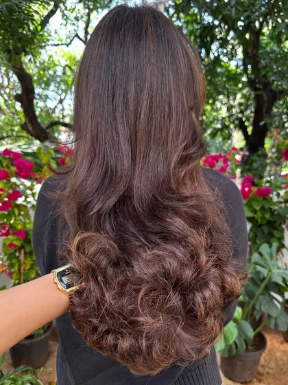 This photo showcases the beautiful U-shape of the haircut from the back, with long layers that curl perfectly at the bottom.
