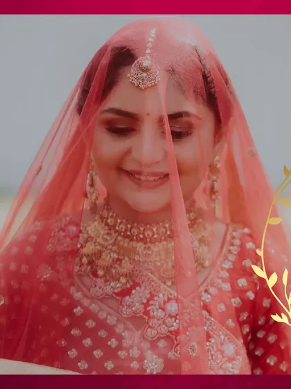 A beautiful shot of the bride under her veil. The soft fabric creates a dreamy, romantic effect, highlighting her delicate features and soft makeup.
