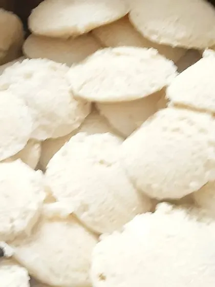 A large batch of soft, fluffy idlis ready for a housewarming breakfast. We made over 30kg of food for this event, all from our home kitchen.