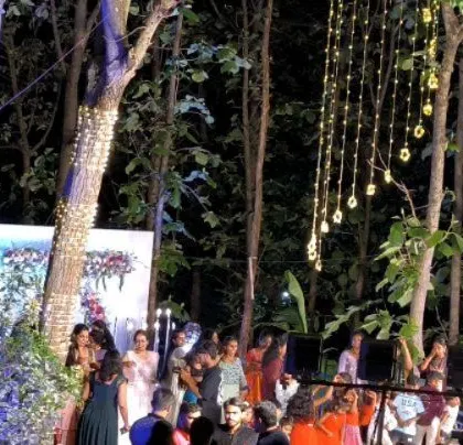 The beautiful outdoor wedding venue with hanging lights.