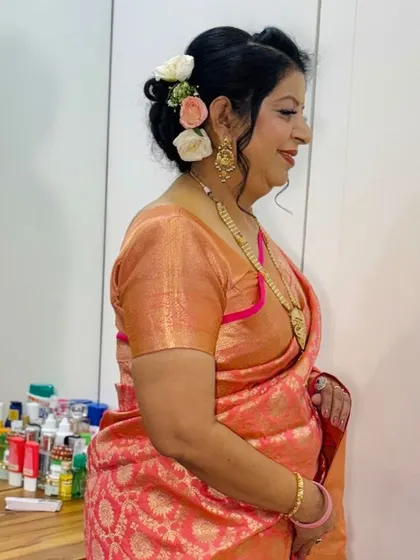 A side profile showing the floral details in her hair.