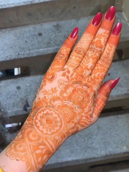 Here you can see the beautiful, deep orange stain that develops from my homemade natural henna paste. I never use chemicals, so you get a rich, long-lasting color that is safe for your skin.