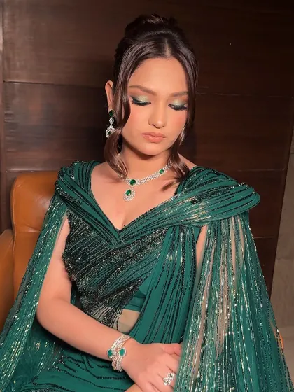 A closer look at the eye makeup for this glamorous green ensemble. I used a hint of metallic green on the lids with a sharp, extended liner to create a look that is both modern and perfectly coordinated with the outfit.
