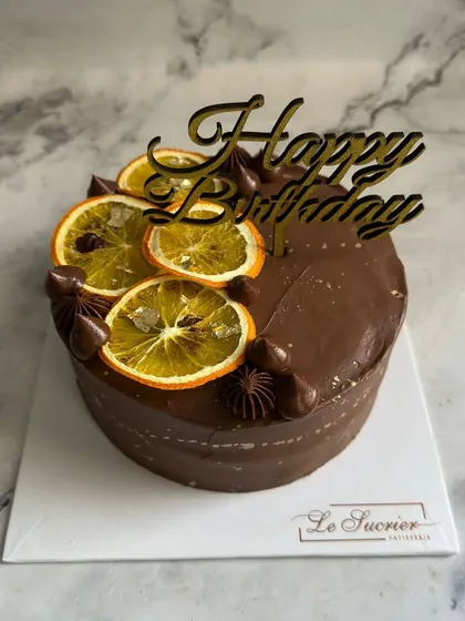 A zesty and decadent combination. My Orange & Chocolate cake is topped with candied orange slices and rich Belgian chocolate ganache.