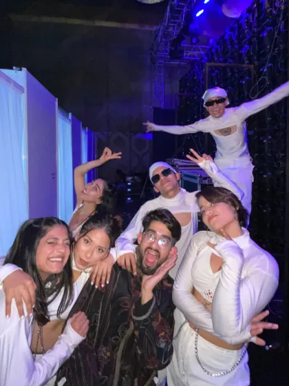 Backstage vibes with the whole crew after a concert performance. We're a team, and that energy translates directly to the stage for a powerful group act.