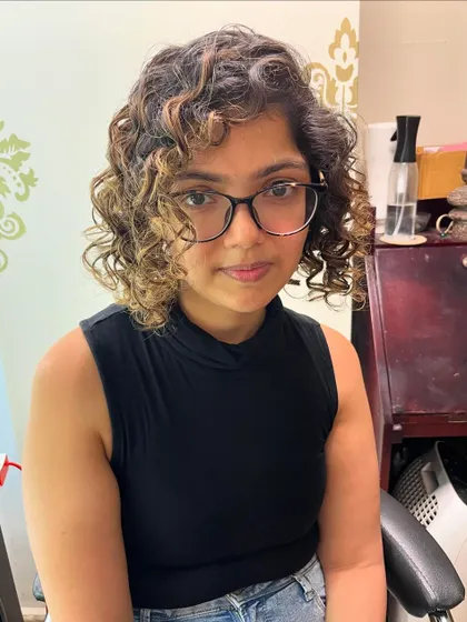 The highlights accentuate her beautiful curl pattern.