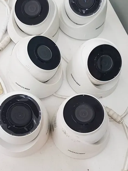 A collection of Hikvision dome cameras ready for a multi-room indoor installation project.