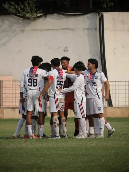 The team huddles before the first game of the season. Unity and focus from the very start.