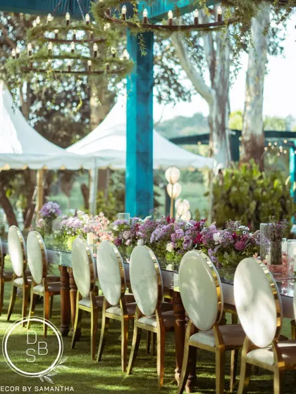 A side view of the stunning mirrored long table. The reflection of the sky and surrounding greenery on the tabletop created a truly magical effect for the reception dinner.