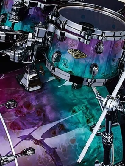 Another angle of the Tama Starclassic Walnut Birch kit, showing the kick drum and mounted toms. The hybrid shells provide the warm low-end of walnut with the clear attack of birch.