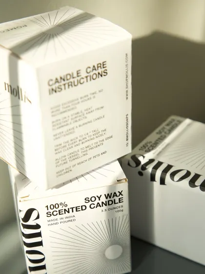 My commitment to thoughtful design extends to my packaging. My 100% soy wax candles come in minimal black and white boxes with care instructions printed directly on them to reduce paper waste. It’s about creating a beautiful product that is also conscious of its environmental impact.