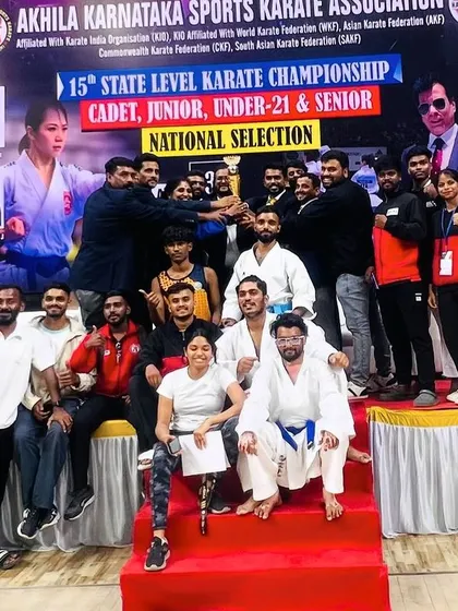 The entire contingent of athletes and supporters celebrating our team's success.