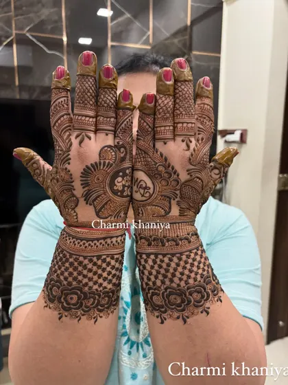 A traditional yet fancy design with a personalized initial in the center. The checkerboard pattern on the wrist is a classic touch.