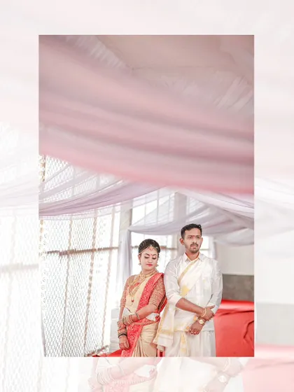 A quiet, artistic portrait of the couple standing together during their wedding ceremony, framed by the soft pink canopy above.