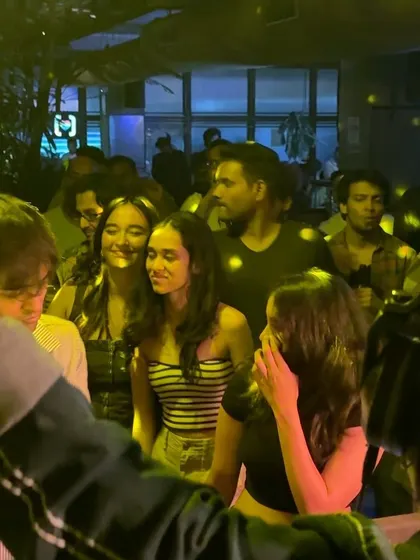 A group of friends enjoying the vinyl set.