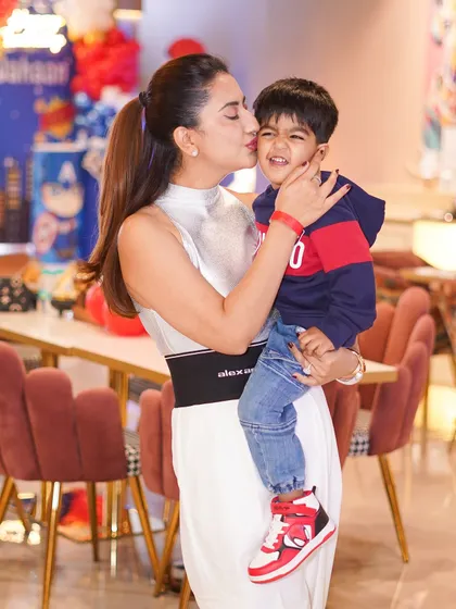 A sweet kiss for the birthday boy. Our warm and inviting atmosphere is perfect for capturing these candid, love-filled family photos.