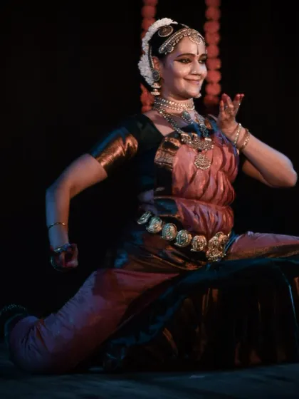 A dynamic pose that showcases the dancer's strength, flexibility, and control.