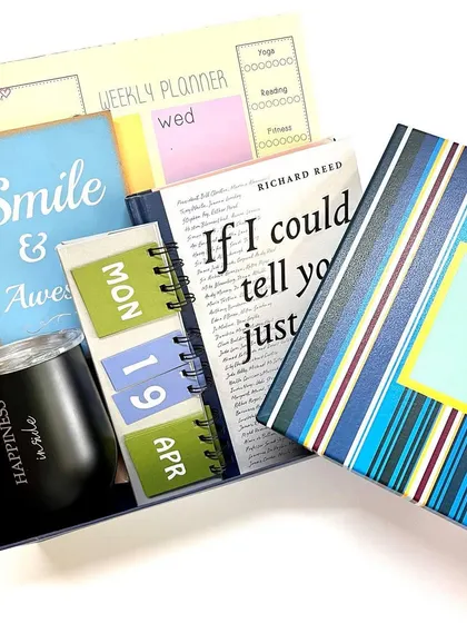 Our 'Escape to Happiness' boxed gift set is perfect for any occasion, from birthdays to Mother's Day. It's packed with a planner, calendar, book, and sipper to inspire joy.