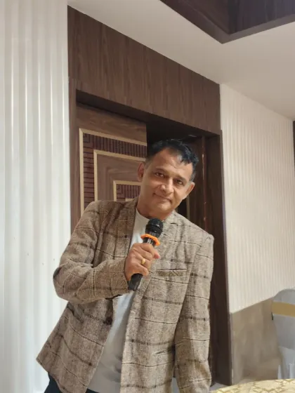 A confident look for the camera before an event. Holding the microphone is second nature to me, and I'm always ready to talk and engage with the crowd.