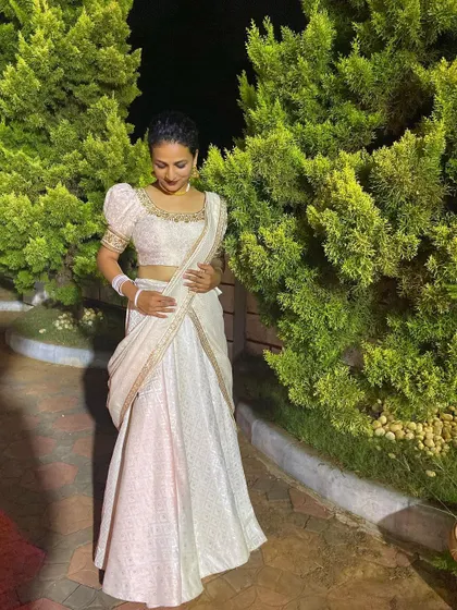An elegant off-white lehenga with puff sleeves, perfect for a sophisticated evening look or a Christian wedding.