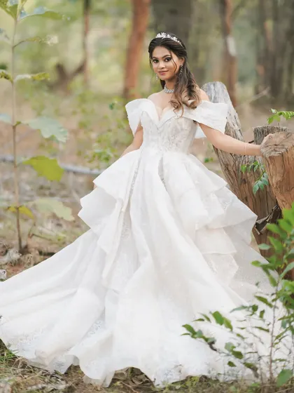 This image captures the dreamy, fairytale quality of a Christian wedding. The makeup is designed to look beautiful in natural, outdoor lighting.