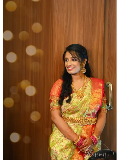 My engagement look. I chose a beautiful golden green saree and draped it myself. This photo captures the happy, glowing feeling of that day, with a bokeh background adding a touch of magic.