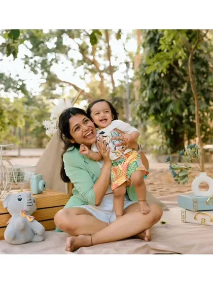A big, happy hug! This candid shot perfectly captures the joyful and loving relationship between this mom and her child.