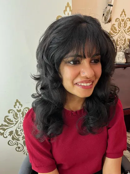 A long shag haircut for Amrita that works with her natural texture. This is a versatile cut that looks great with minimum effort.