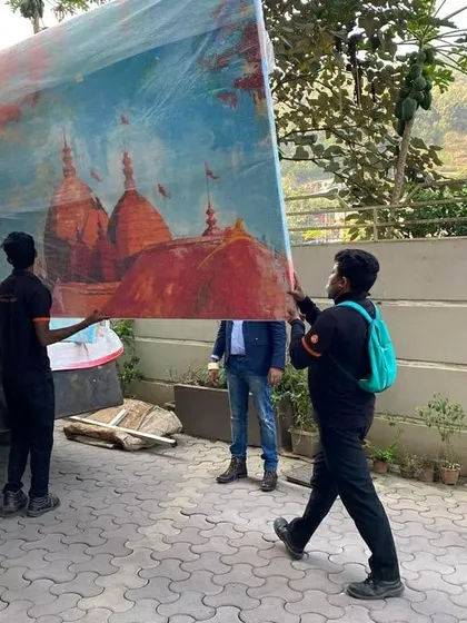 Our team carefully loading the Kamakhya painting for delivery. We handle every piece with the utmost respect and care.
