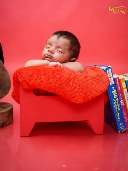 A simple and sweet portrait of a sleeping newborn. Without any props, the focus is entirely on the baby's natural beauty and innocence.