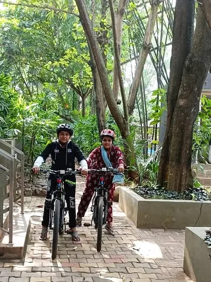 Two young guests get ready for a bike ride. We provide activities that the whole family can enjoy, encouraging outdoor fun and exploration.