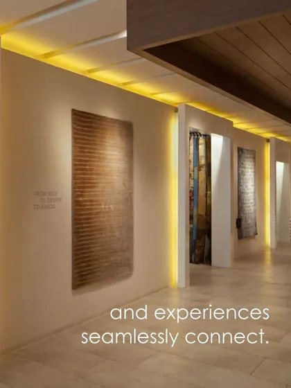 In the Hands Carpets showroom, lighting and spatial divisions create a curated journey. Here, illuminated niches and distinct zones guide the customer through the collections, ensuring the experience is seamless and engaging.