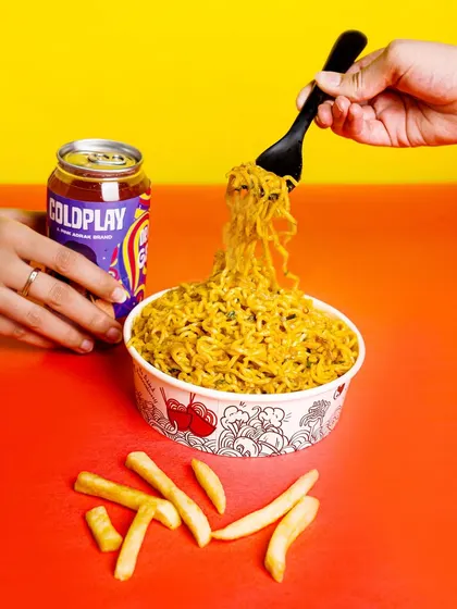 Making food look irresistible is an art. For this shot, we focused on creating a sense of action and flavor, capturing the perfect noodle pull against a vibrant, color-blocked background to make the image pop on any feed.