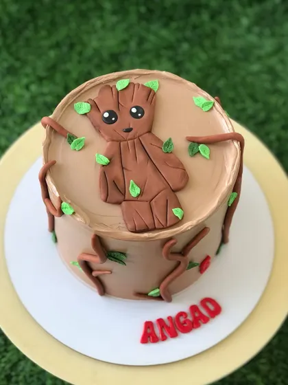 This angle of the Groot cake shows off the detailed buttercream work that creates a tree-like texture.