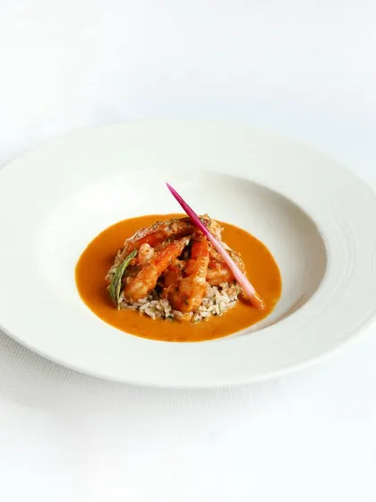 Another look at our braised prawns, showcasing the vibrant colour of the raw mango curry and the perfectly cooked prawns.