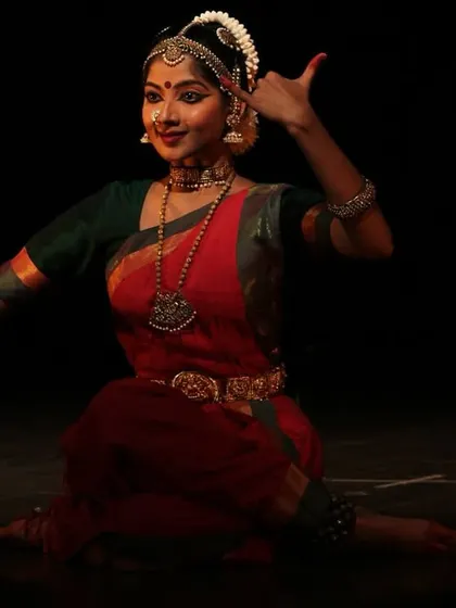 A quiet moment of expression during a solo recital. Here, I am portraying a line from a verse, using hand gestures and facial expressions to convey the poetry of the music.
